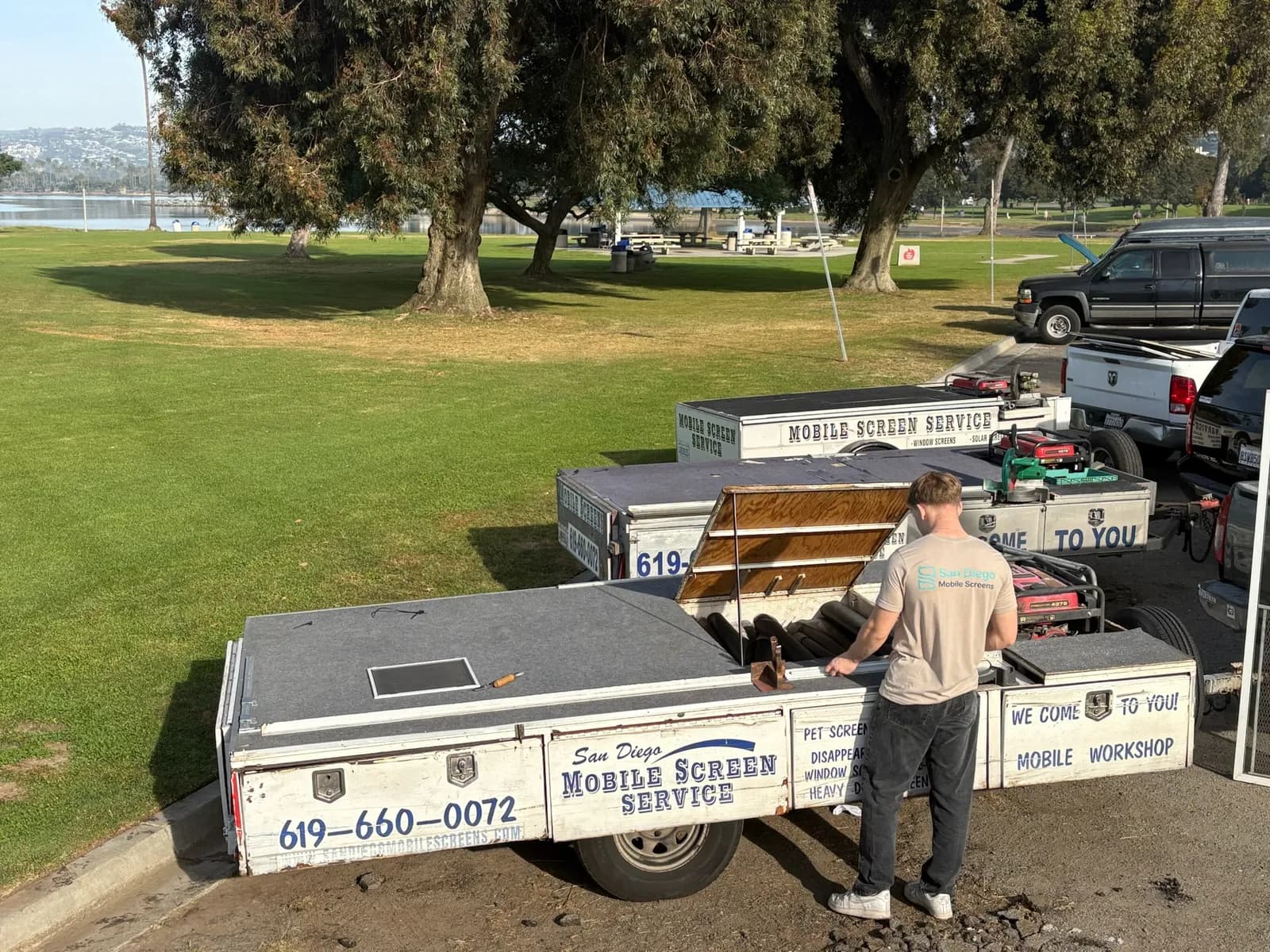 Technician working at the mobile screen workshop trailer in San Diego